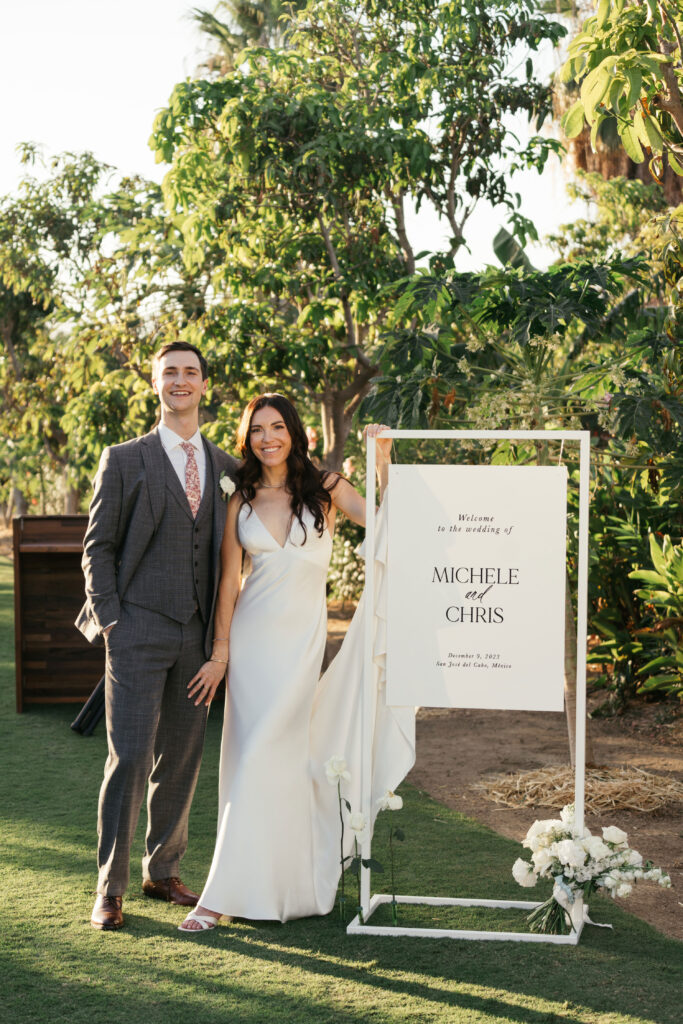 Welcome sign and bridal couple at Flora Farms
